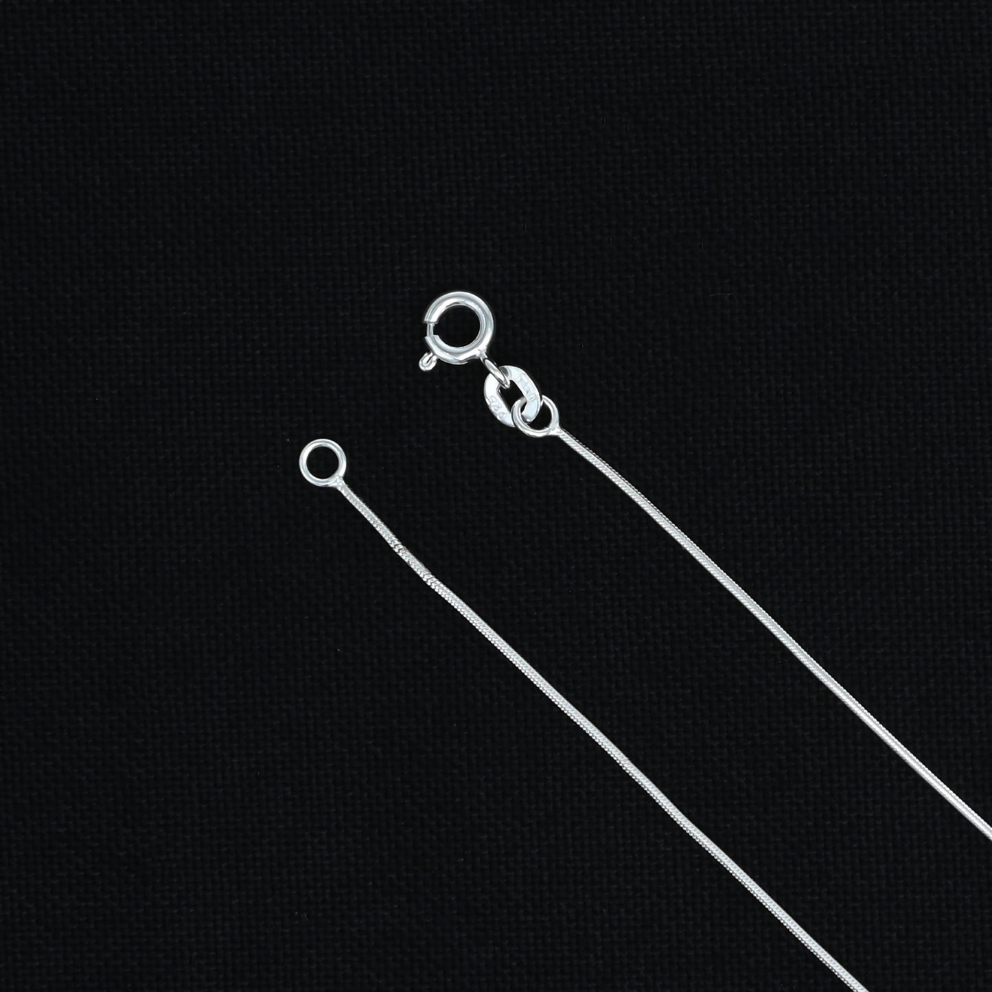 Stylish silver chain with a center CZ oval gemstone pendant, adding charm to any outfit.