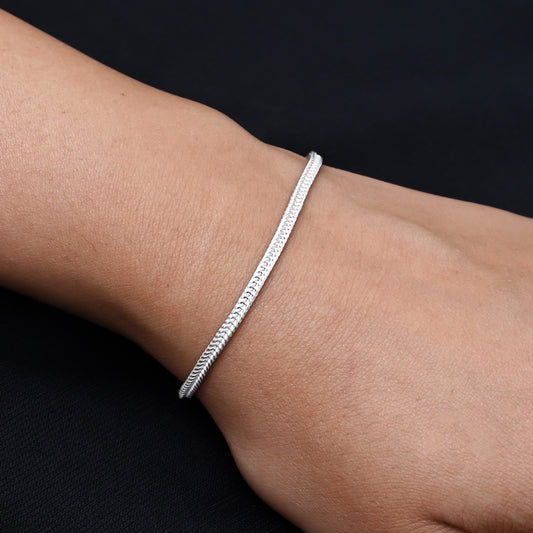 Stylish silver bracelet for boys with a textured snack skin pattern
