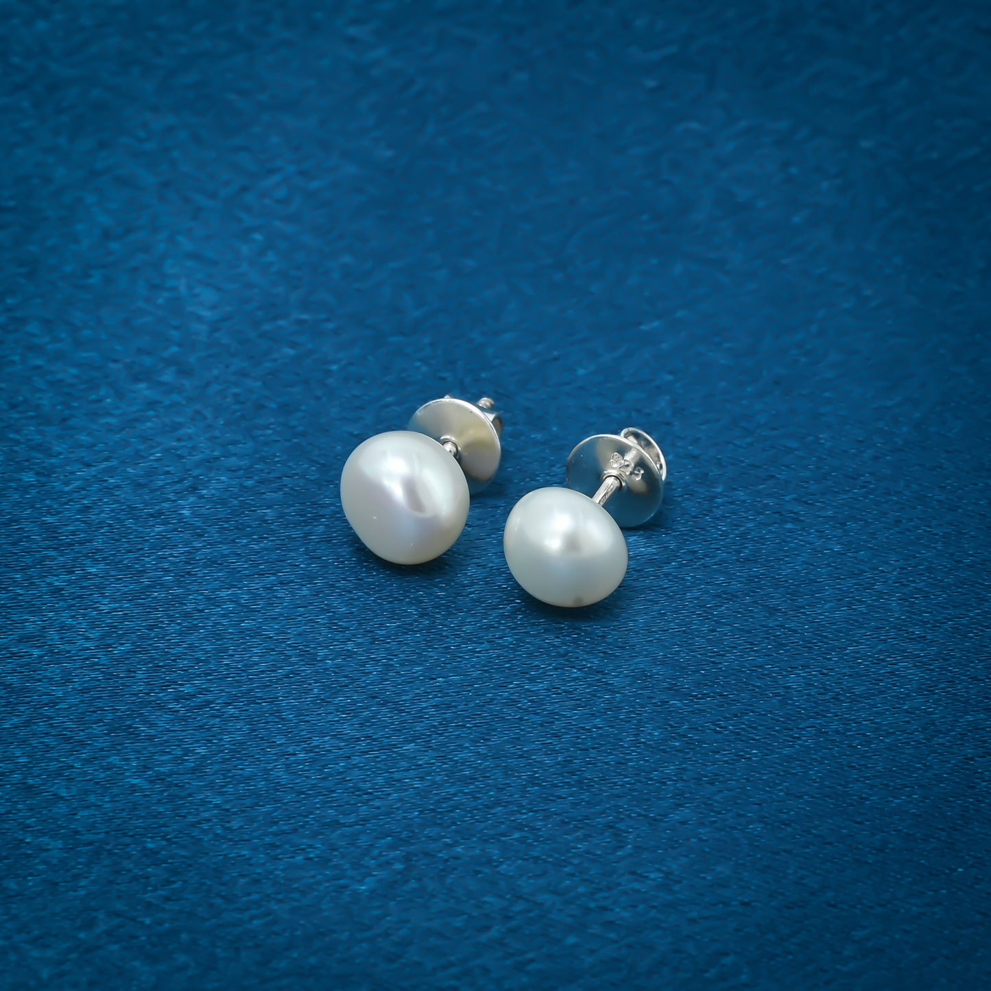 Stunning sterling silver earrings adorned with clear pearls