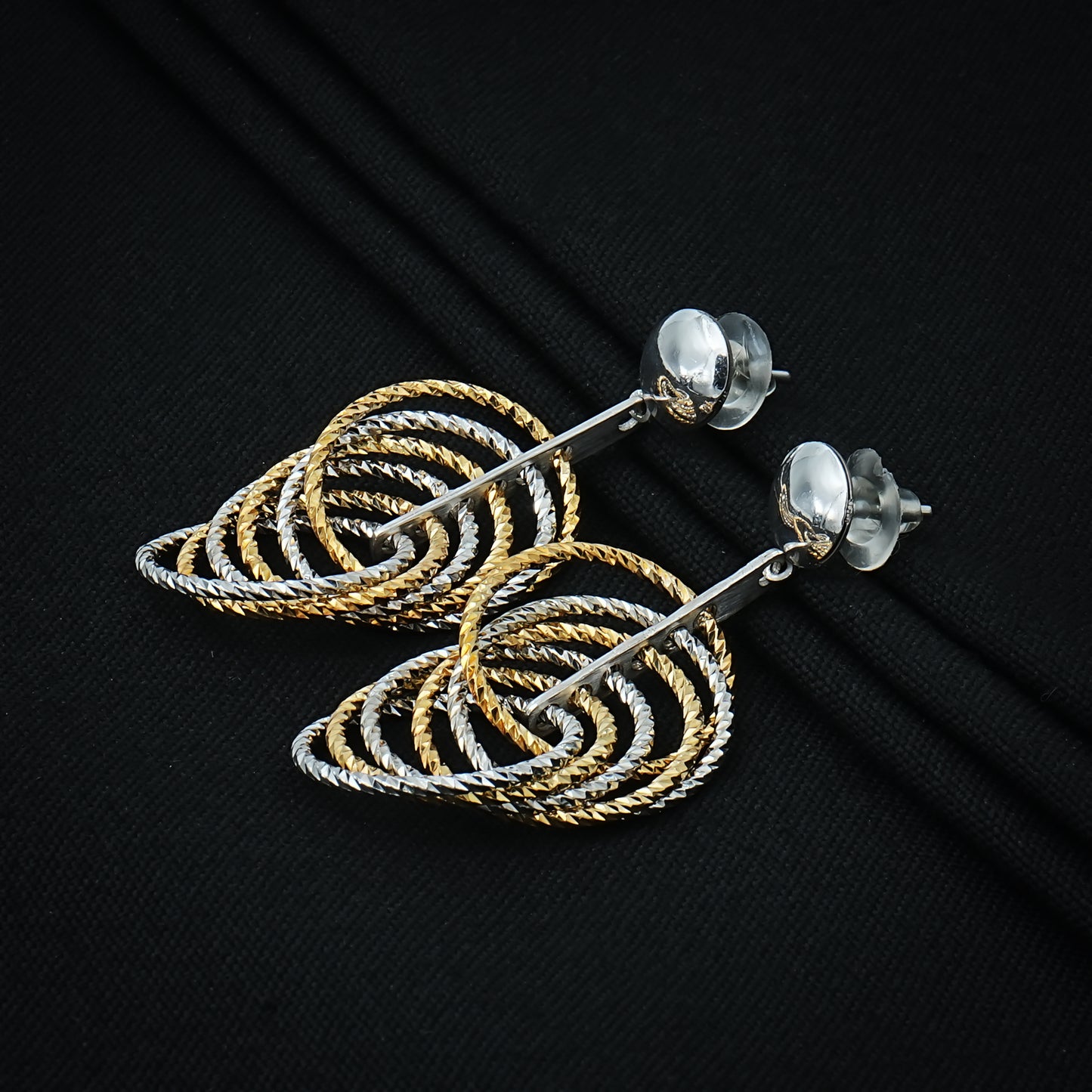 Stylish tiered silver earrings in a teardrop shape