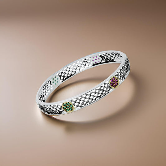Charming silver chudi adorned with colorful gemstones and a wind and flower motif, perfect for a unique and stylish look