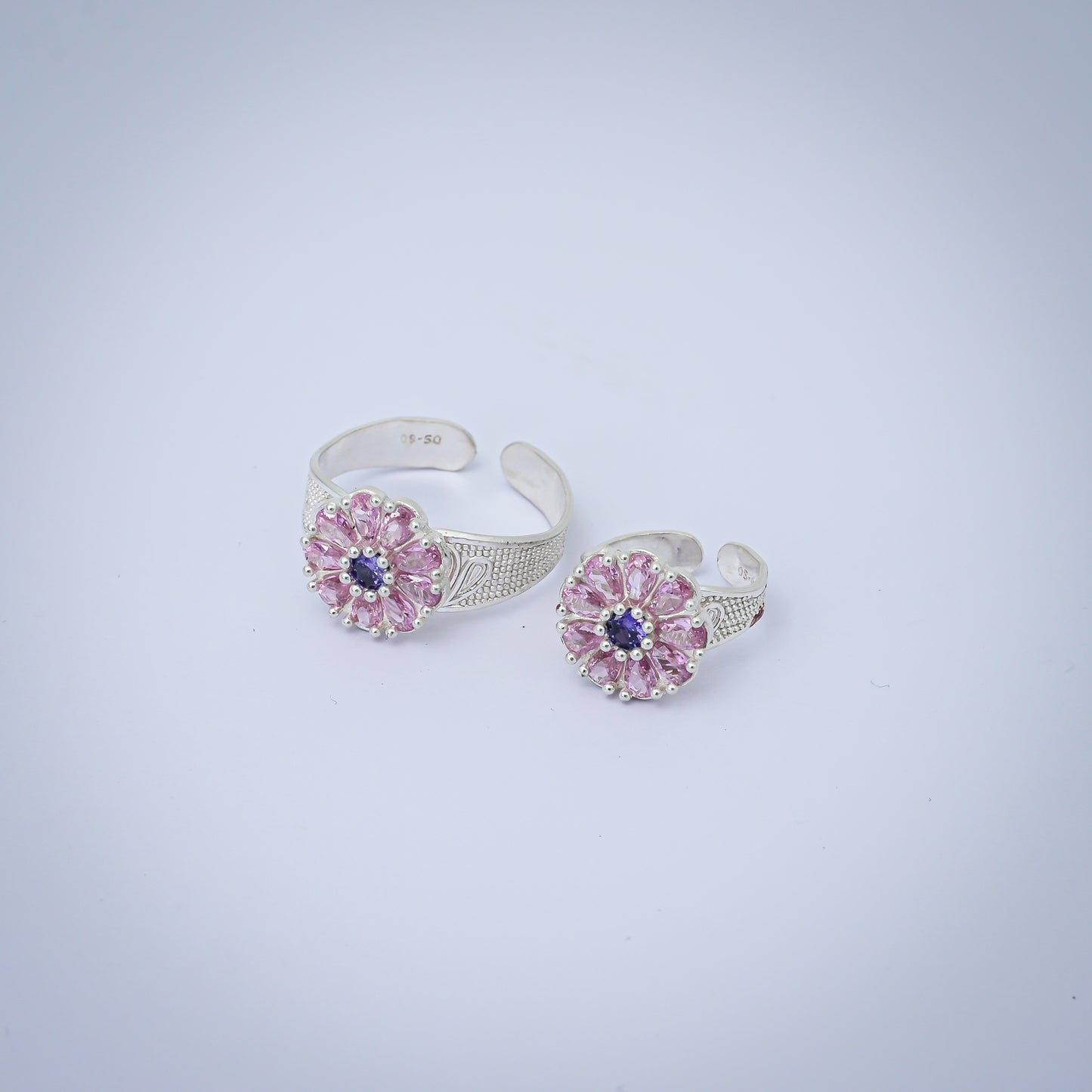 Elegant flower design silver toe rings with pink stones, set of 4.