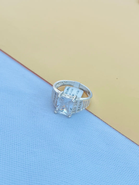 Sleek silver ring for men and boys with a single white gemstone.