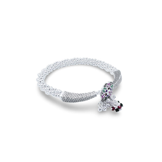 Women's silver kada anklet featuring an elegant floral design.