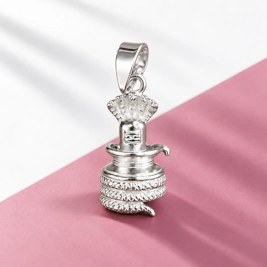 Silver Shivling pendant with cobra hood and coiled Naag design on a dark brown textured background