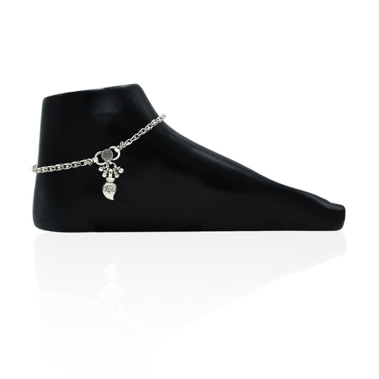Elegant silver anklet featuring flower motifs and dangling beads