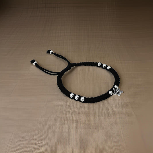 Elegant silver payal featuring butterfly design and beads.