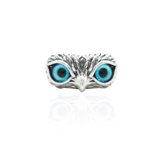 Silver ring featuring an owl design with detailed eyes, offering a classic and whimsical touch