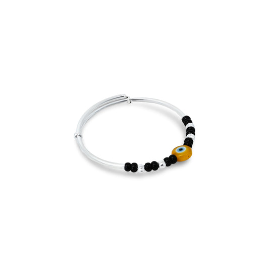 Charming silver kada anklet for babies, adorned with a yellow evil eye and black and silver beads