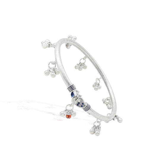 Elegant silver kada anklet with a traditional peacock symbol for a graceful look.