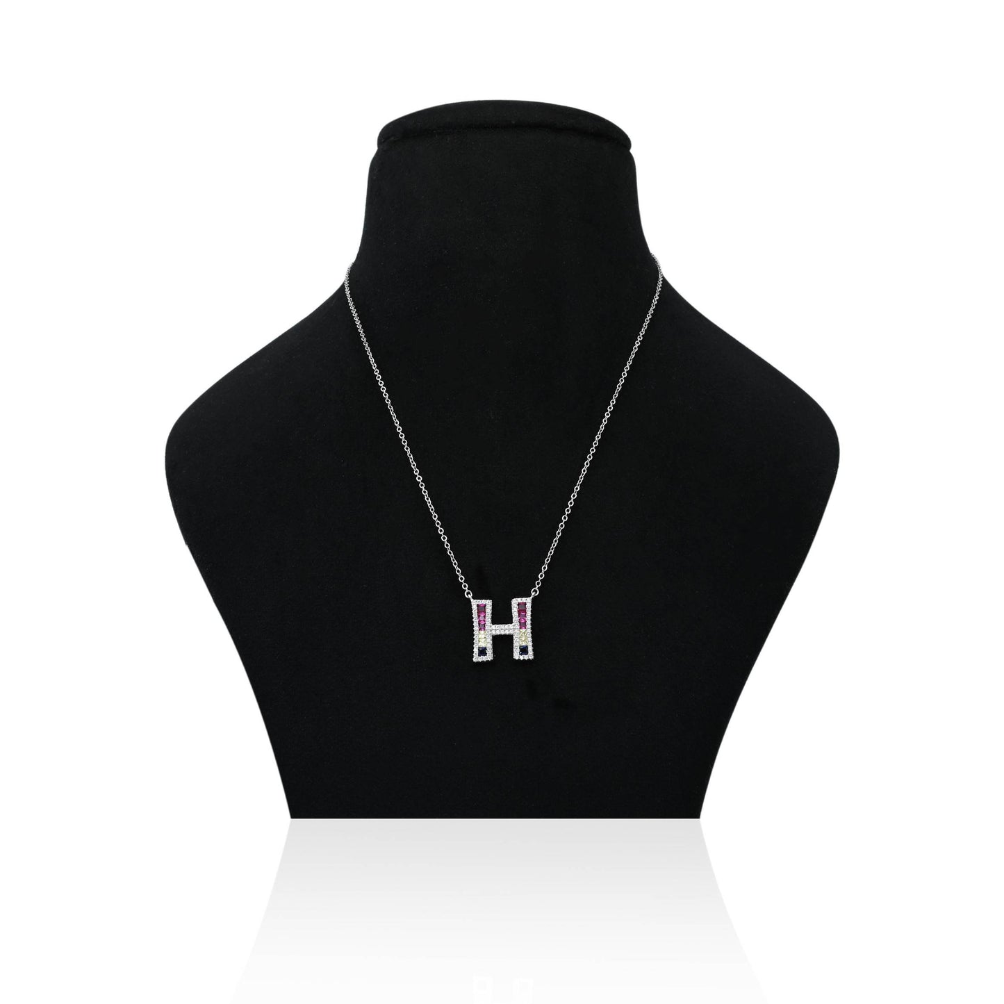 Custom silver chain with personalized 'H' symbol pendant.
