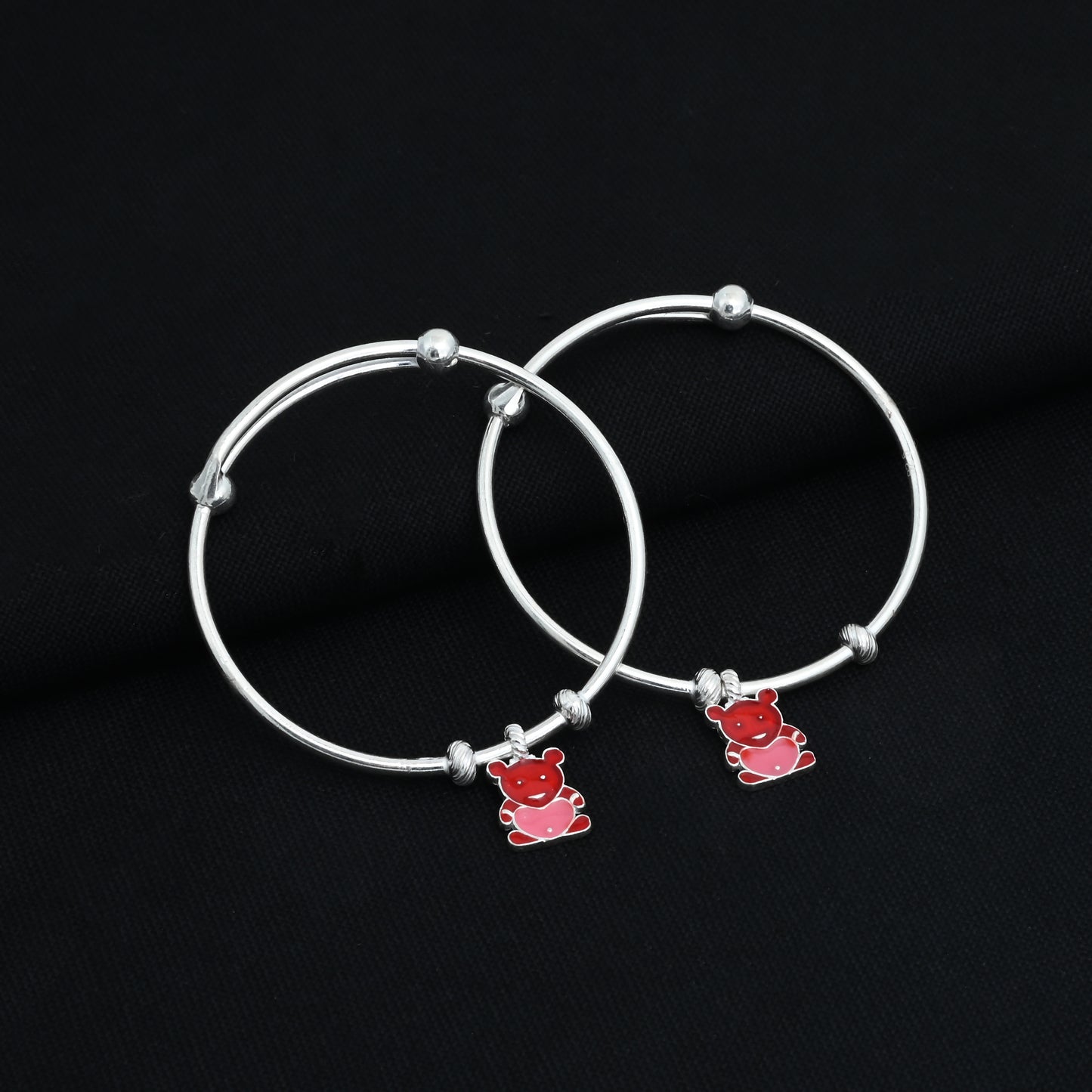 Charming silver kada payal for babies with a central red teddy bear motif.