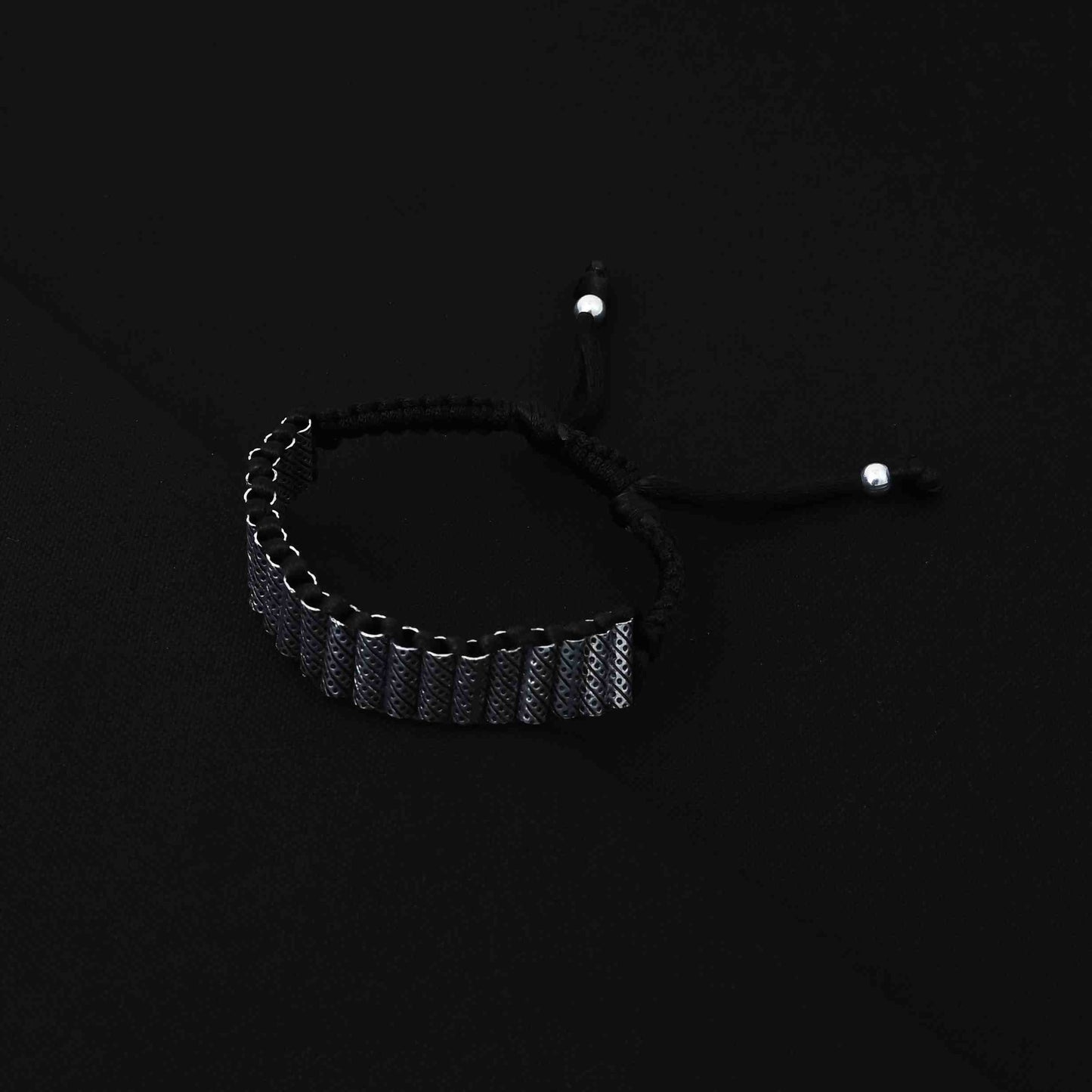 Trendy silver bracelet for boys showcasing cylinder-shaped beads in a sleek design