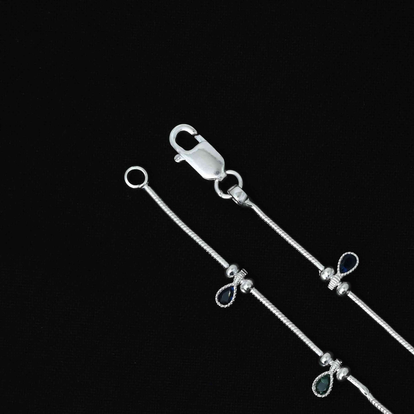 Silver anklet for girls featuring a striking oval green stone in a plain design for a sophisticated look