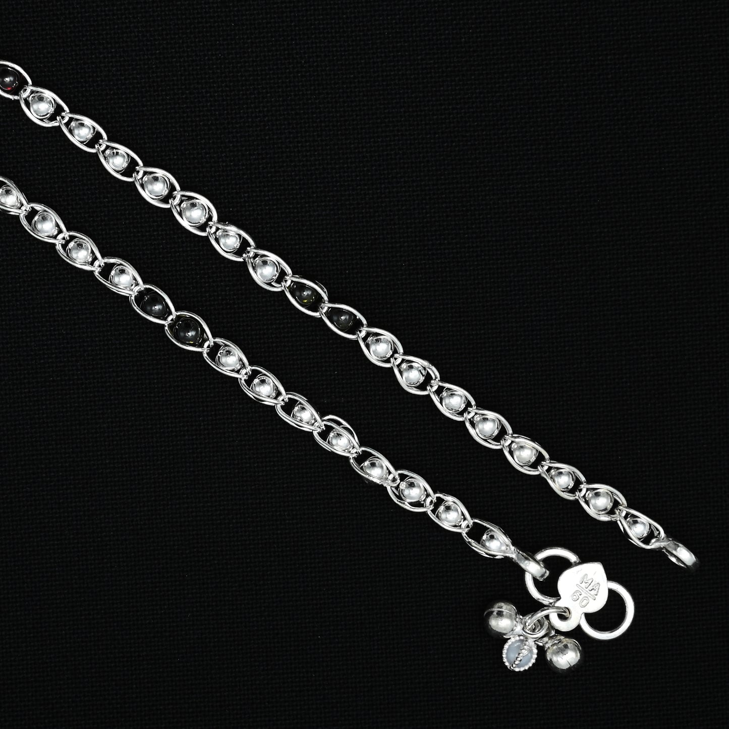 Silver anklet adorned with a distinctive kneaded treasure motif