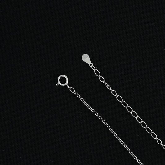 Silver chain with a custom 'E' symbol pendant.