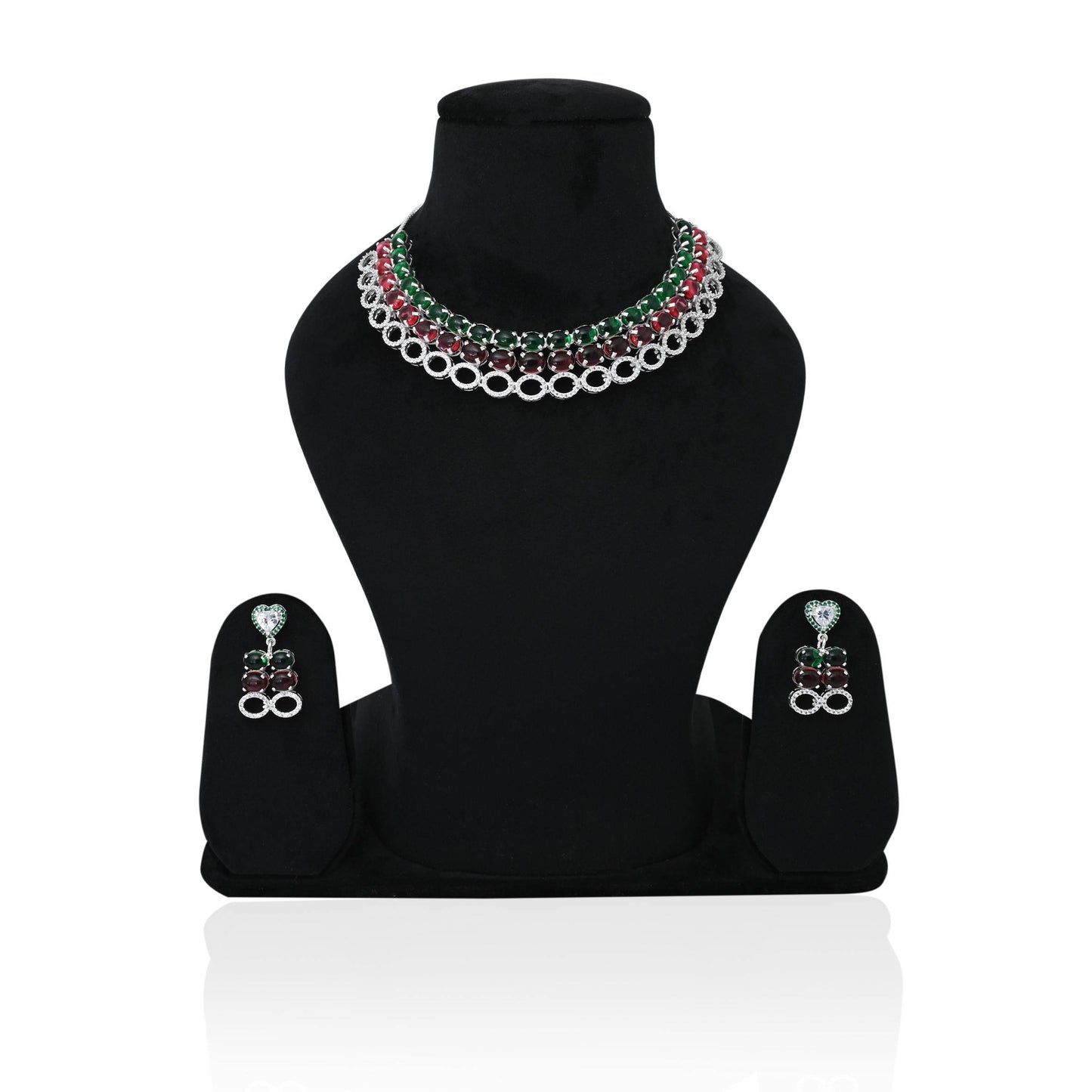 Luxurious silver bridal set with gemstone necklace and earrings.
