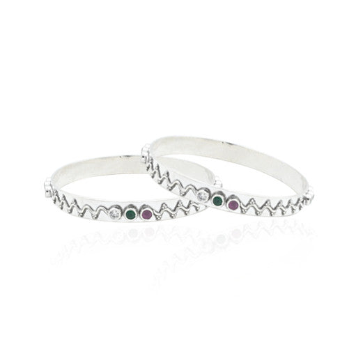 Silver bangles with a radical two-storm wave design