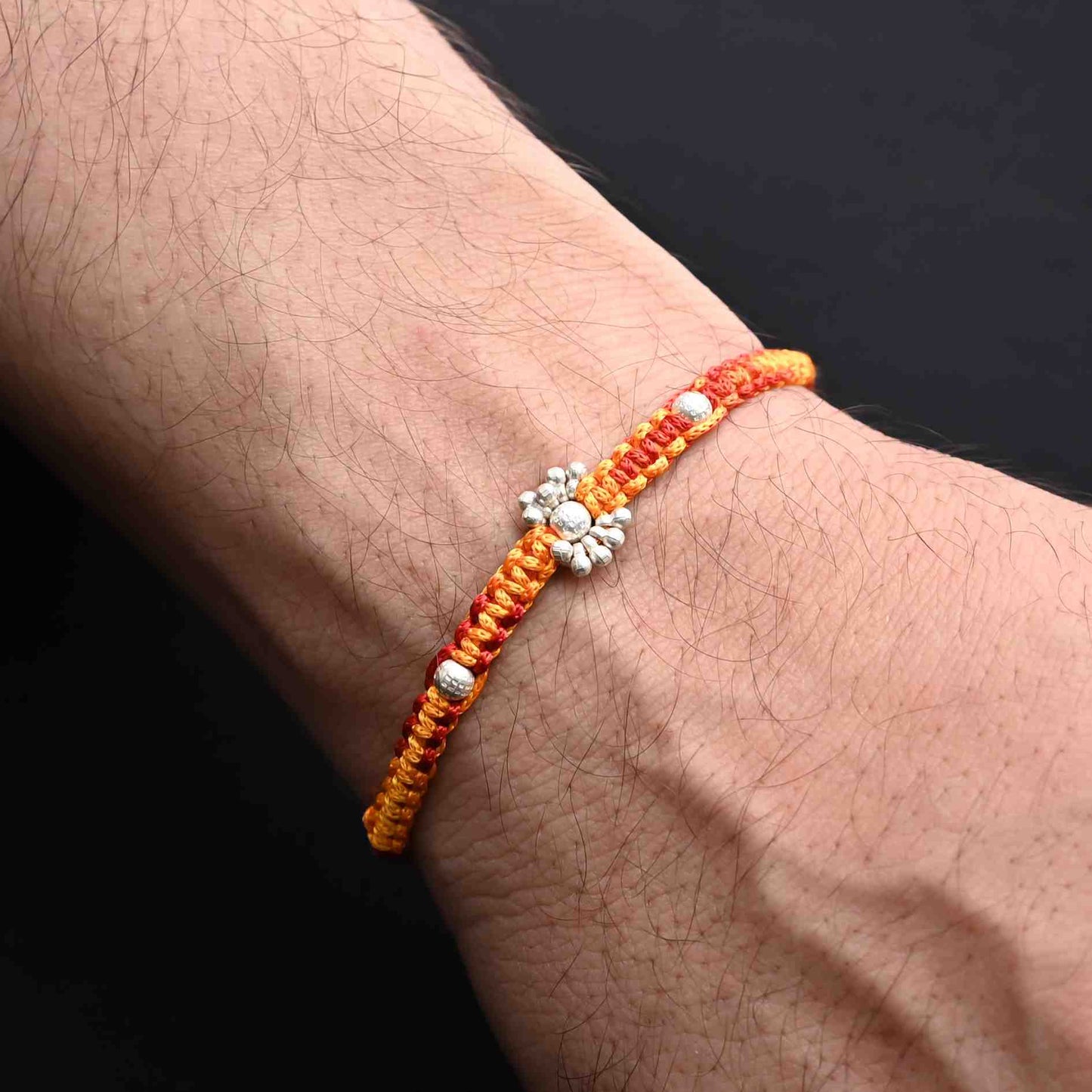 Boys' Rakhi featuring shimmering silver beads for a modern look