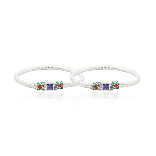 Silver bangles featuring a gorgeous center with colorful design accents