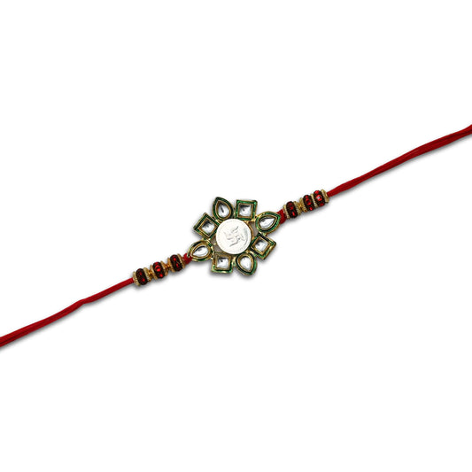 Boys' Rakhi featuring a silver Swasthik flower centerpiece with vibrant multi-color beads.