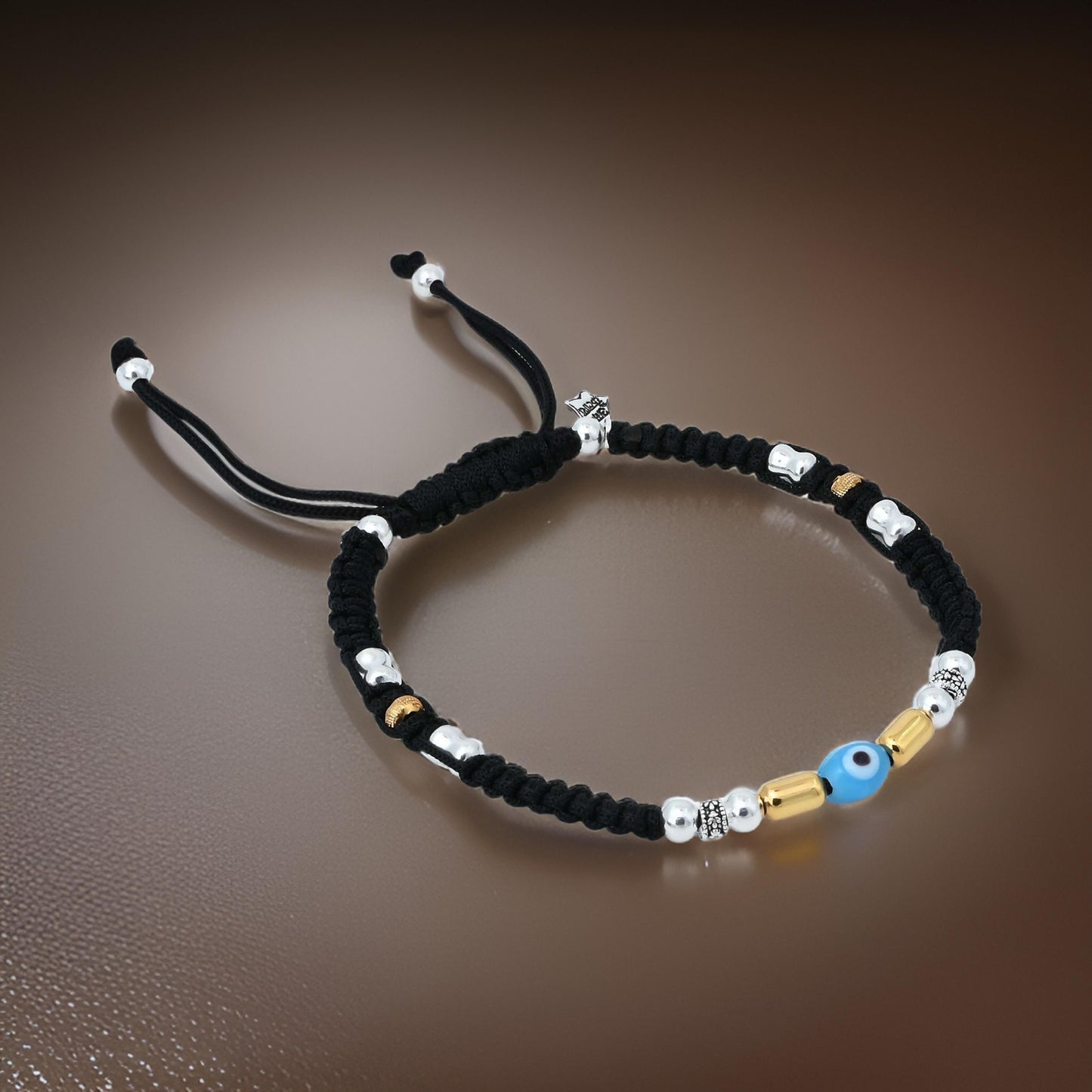 Charming evil eye dhaga payal with gold beads.