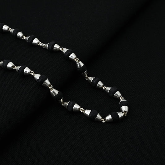 Auspicious Tulsi mala in silver, featuring intricate engravings for enhanced spiritual practice.