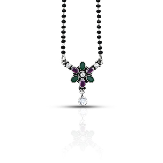Elegant sterling silver mangalsutra with round purple and green gemstones, creating a vibrant contrast