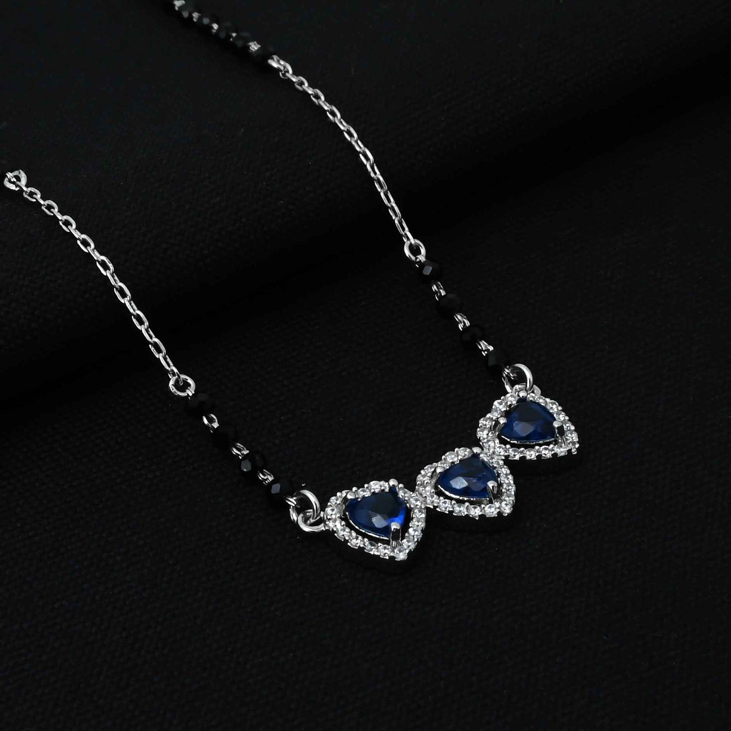 Chic sterling silver mangalsutra with three stunning heart-shaped blue stones for girls