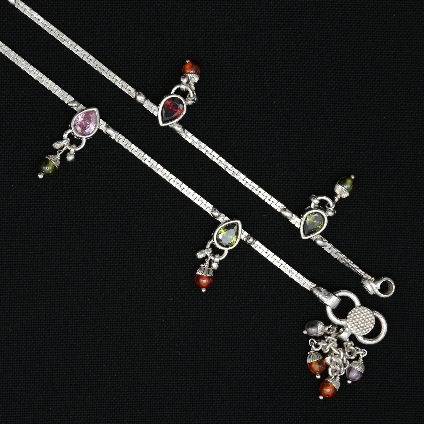 Stylish silver anklet with delicately rated colourful gems for a graceful appearance