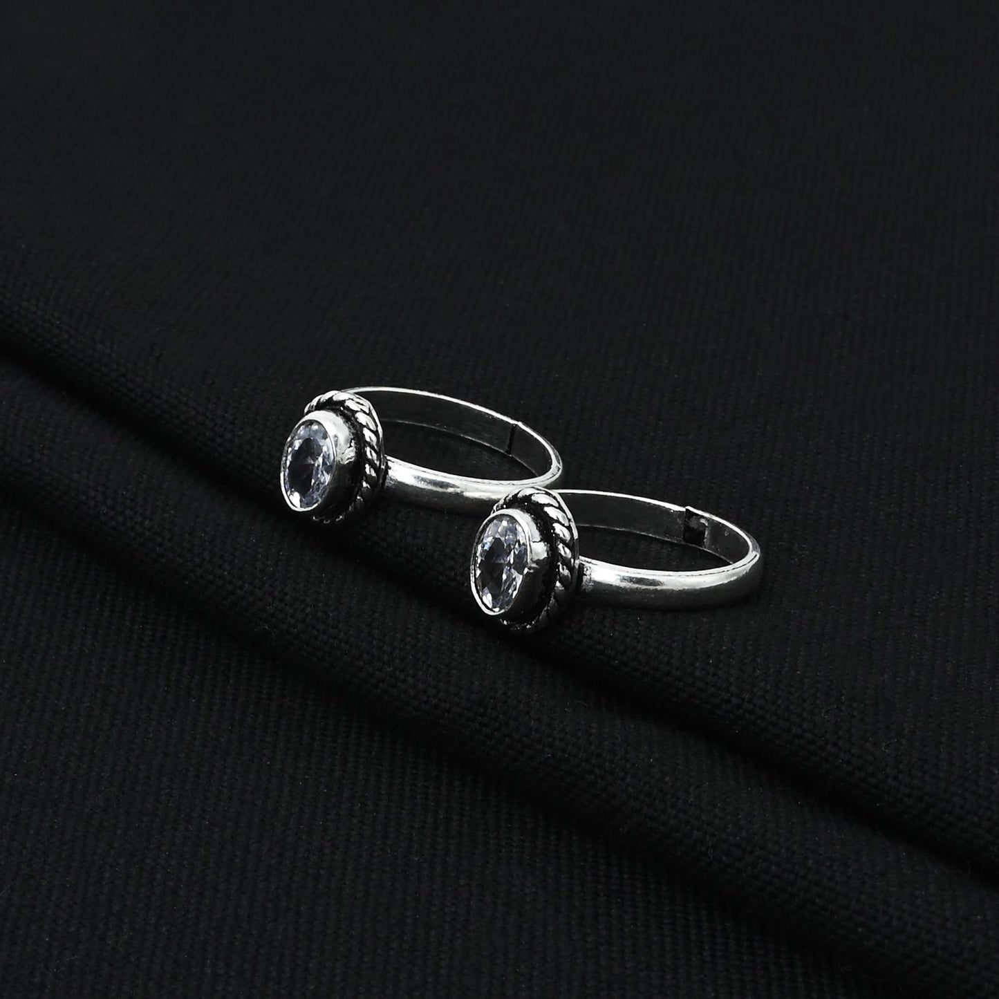 Handcrafted silver toe rings featuring white gems, perfect for adding a subtle touch of sophistication