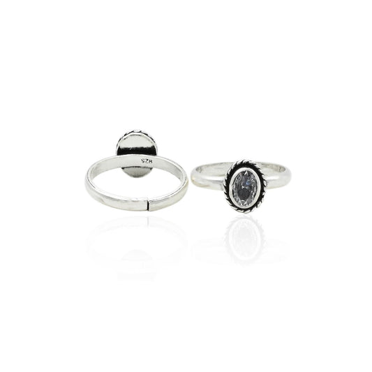 Charming silver toe rings adorned with white gems, perfect for a timeless, elegant style