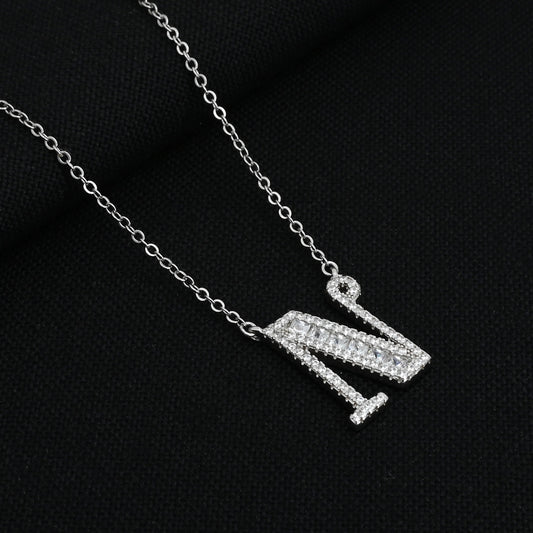 Elegant silver chain featuring a personalized 'N' pendant.