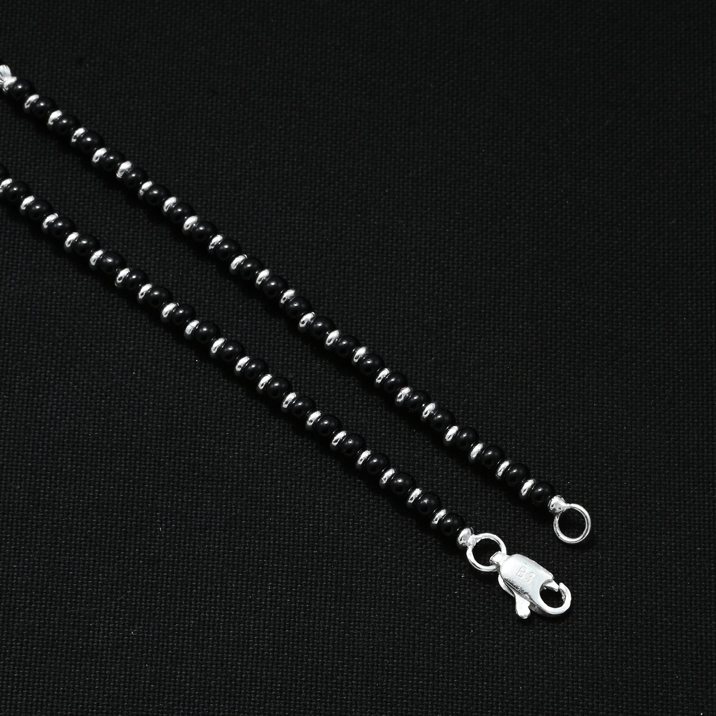 Beautiful silver anklet with black elements, offering a stylish and elegant appearance