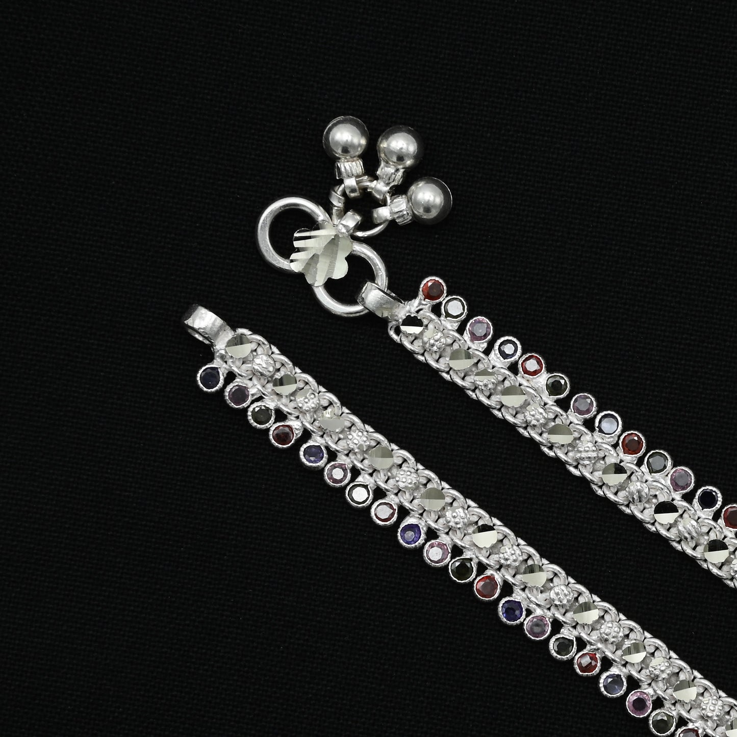 Silver anklet embellished with vibrant colorful gems for a fashionable finish