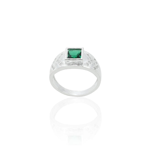 Close-up of a silver ring for boys with a stunning green gemstone, perfect for adding a pop of color and sophistication