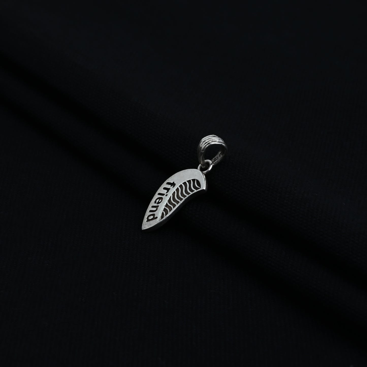 Charming silver pendant with 'Friend' written and a unique half-heart design for boys