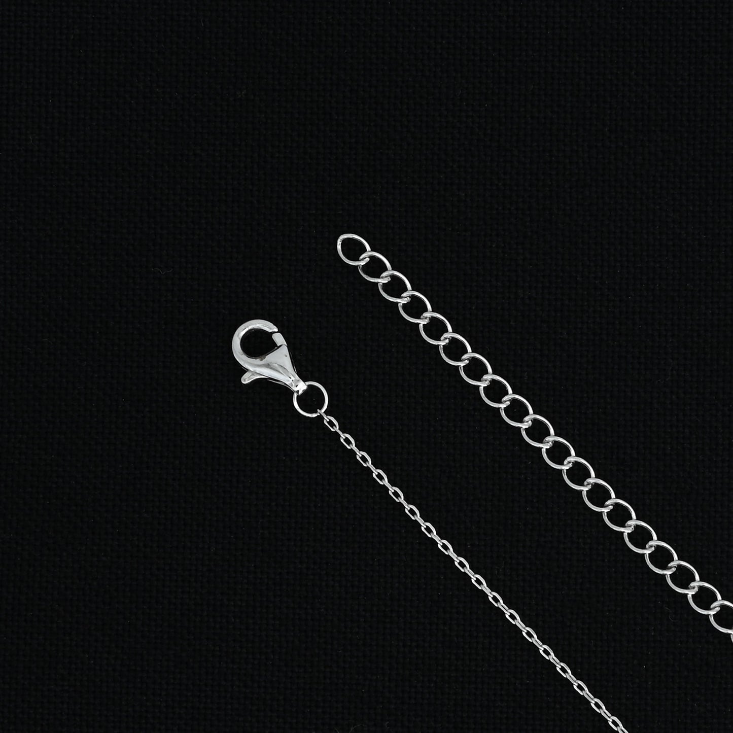 Elegant silver chain with an evil eye pendant, perfect for protection and style.