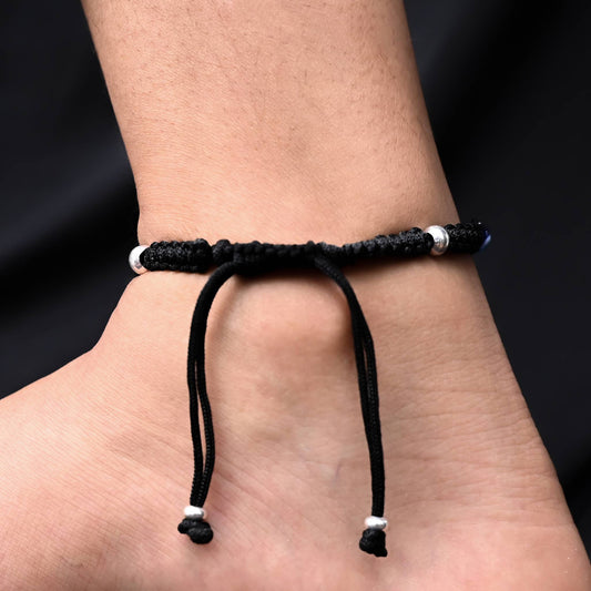 Silver dhaga payal featuring charming evil eye.