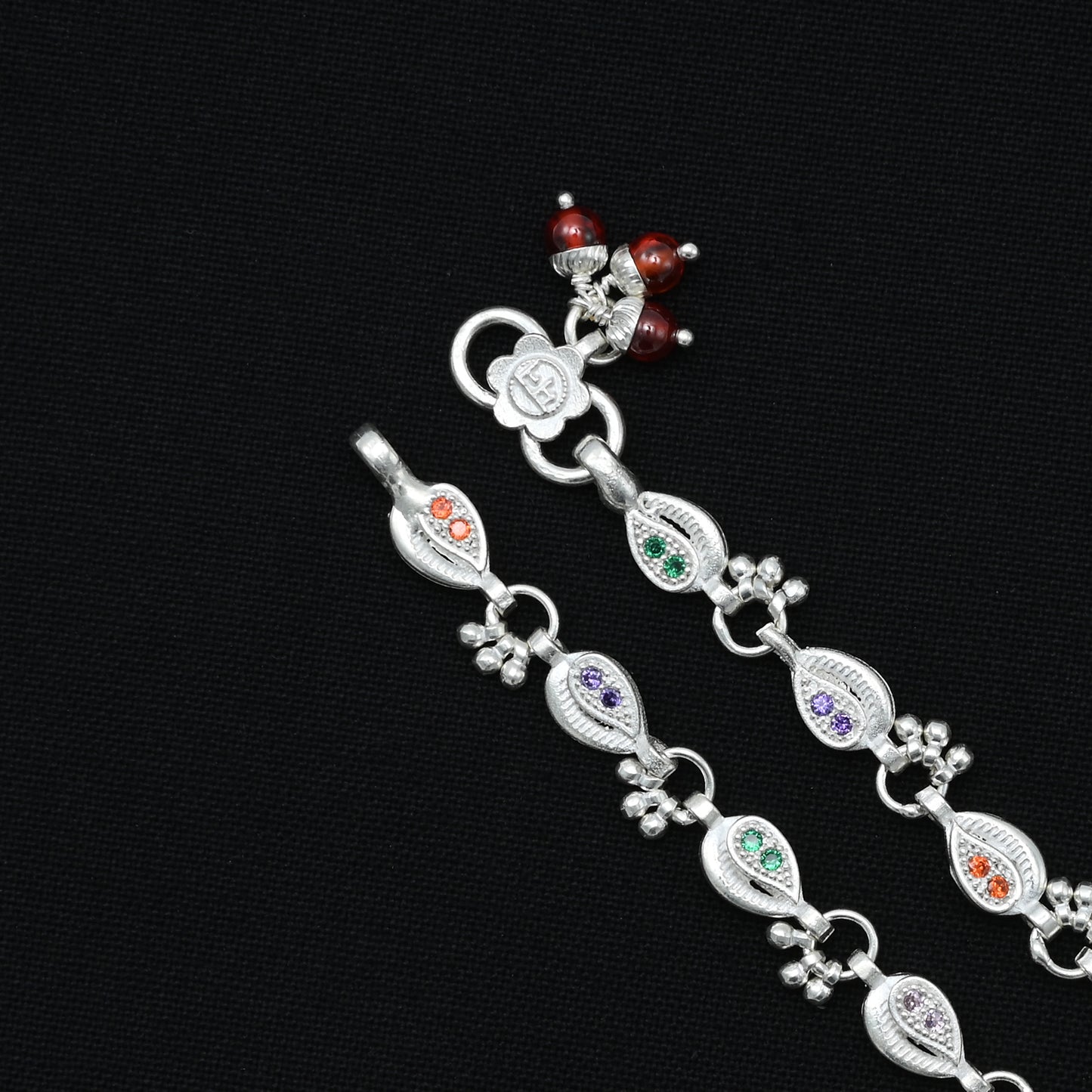 Beautiful silver anklet adorned with colorful minimal gems, perfect for a trendy and elegant appearance