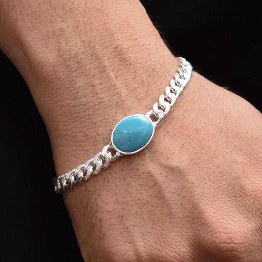Trendy silver bracelet for boys featuring a striking blue gemstone