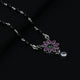 Timeless silver mangalsutra for girls with a beautiful flower design, highlighted by green and purple gemstones