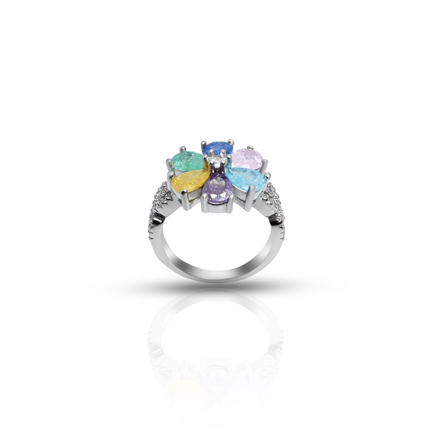 Close-up of a silver ring with a colorful flower and leaf motif, combining bright stones for a fresh, organic style.