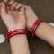 Red Bangles with Silver Floral Design