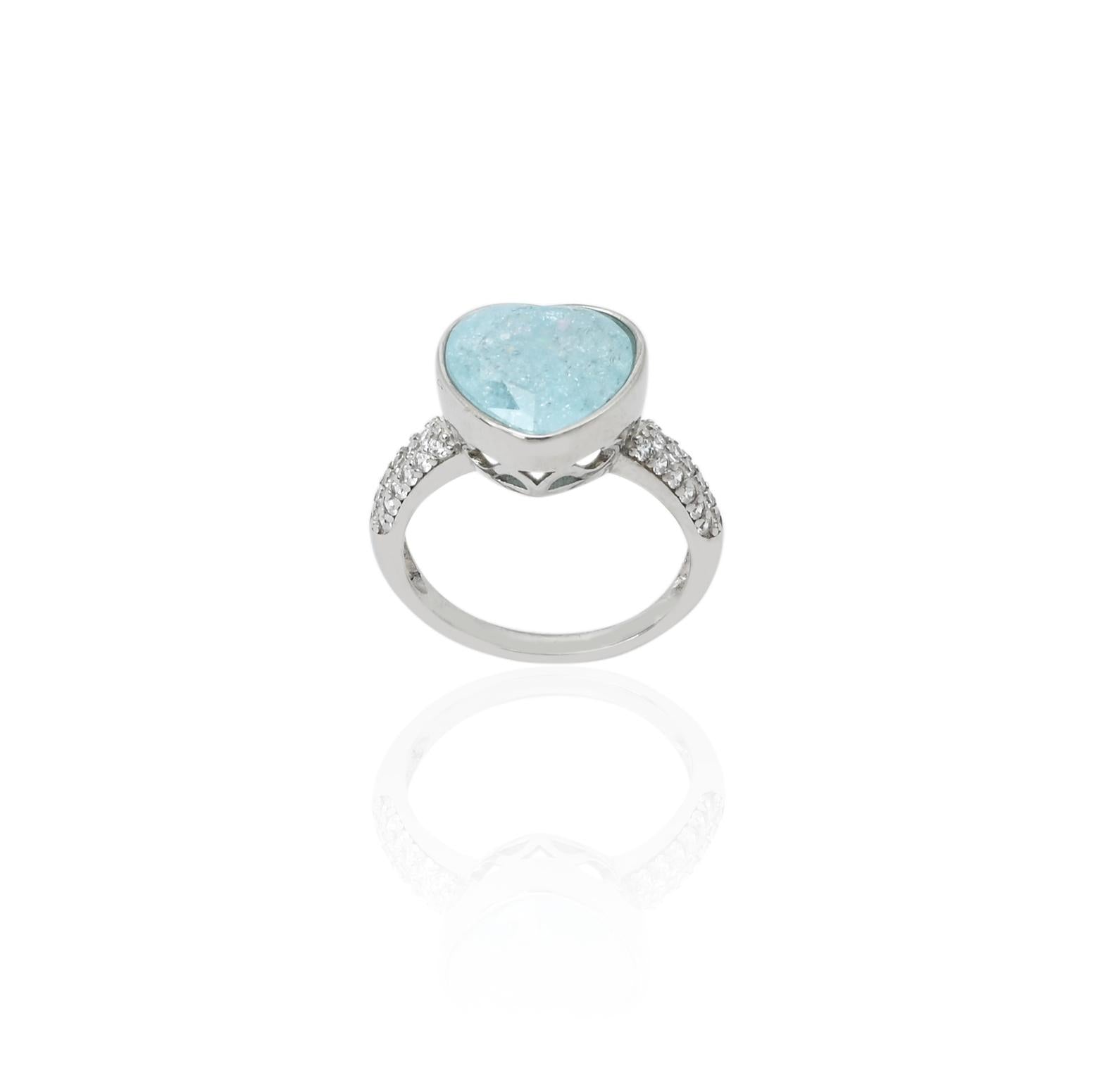 Elegant silver ring adorned with a sky blue heart gemstone, perfect for a feminine touch