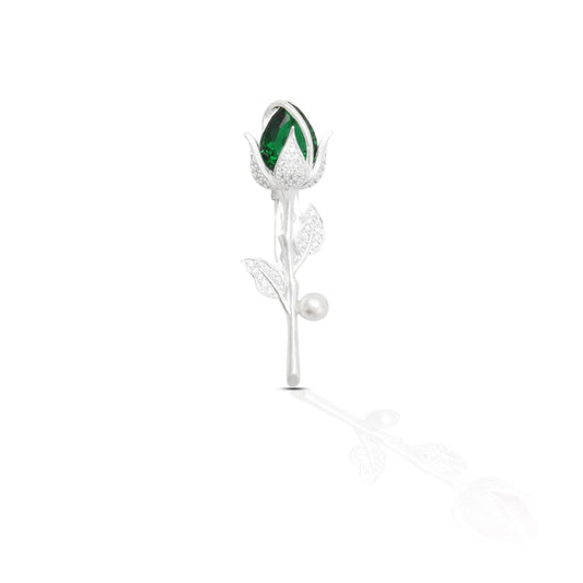 Silver saree pin with a green flower design, offering a fresh and elegant touch.