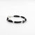 Charming sterling silver bracelet with a black evil eye and black bead accents for girls