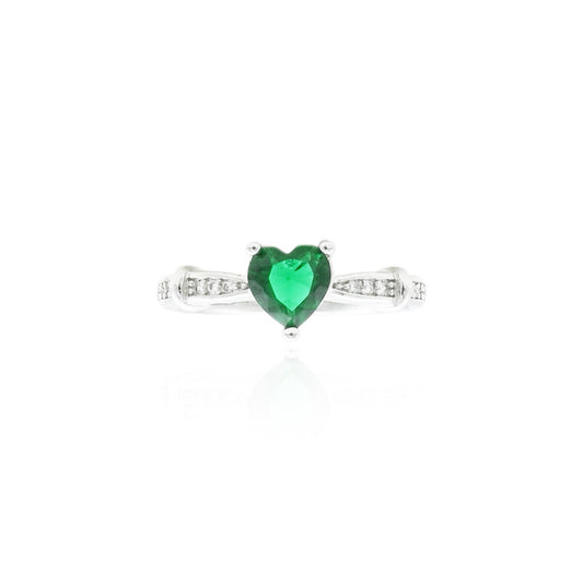 Silver ring featuring a heart-shaped green gemstone, offering a romantic and elegant accessory.