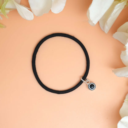 Bracelet with a bold black Evil eye charm