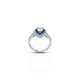 Elegant heart-shaped ring crafted in sterling silver, adorned with sparkling blue and white stones.